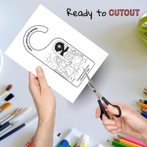 May include: A white door hanger with a black and white illustration of a biblical scene. The text "Listen when God speaks" and "Young Samuel hears God calling him night" are printed on the door hanger. The words "Ready to CUTOUT" are printed at the top.