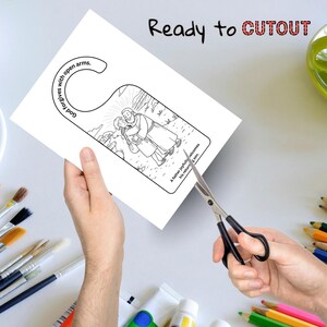 May include: A white door hanger with a black and white illustration of a father embracing his son. The text "God forgives with open arms" and "A father joyfully welcomes his return son" are printed on the door hanger. The words "Ready to CUTOUT" are written at the top.