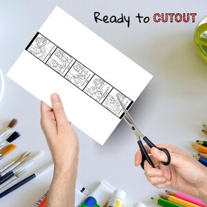 Puede incluir: Una hoja de papel blanca con una tira c&oacute;mica en blanco y negro se est&aacute; cortando con tijeras. La tira c&oacute;mica presenta ilustraciones de personas y texto. Las palabras "Ready to CUTOUT" est&aacute;n escritas en la parte superior del papel.