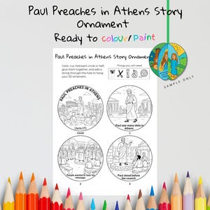 K&ouml;nnte beinhalten: Ein Mal-Bastelset mit dem Text "Paul Preaches in Athens Story Ornament" und "Ready to colour/Paint". Das Set enth&auml;lt einen 3D-Ornament und vier runde Illustrationen zum Ausmalen, Ausschneiden und Zusammenbauen. Buntstifte sind sichtbar.