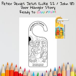 May include: A white door hanger with a black and white illustration depicting a biblical scene. The text "Peter Denies Jesus" and "Ready to colour/paint" are visible. The hanger includes the text "God forgives our failures."