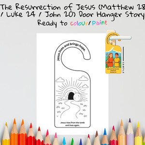 Pode incluir: Um cabide de porta branco com um desenho de contorno preto que retrata a ressurrei&ccedil;&atilde;o de Jesus. O texto diz "A Ressurrei&ccedil;&atilde;o de Jesus" e "Pronto para colorir/pintar". O design inclui um t&uacute;mulo, raios de luz e o texto "Jesus ressurge do t&uacute;mulo e vive novamente."
