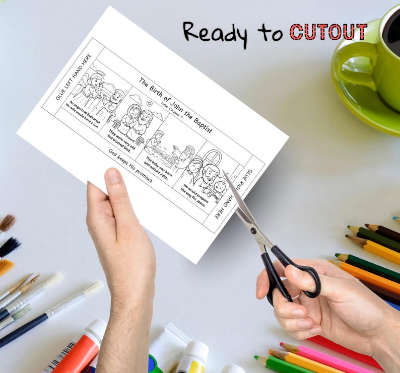 May include: A black and white coloring page titled "The Birth of John the Baptist" is being cut with scissors. The page includes illustrations and text, with instructions to glue on the left and right sides. The words "Ready to CUTOUT" are written at the top.