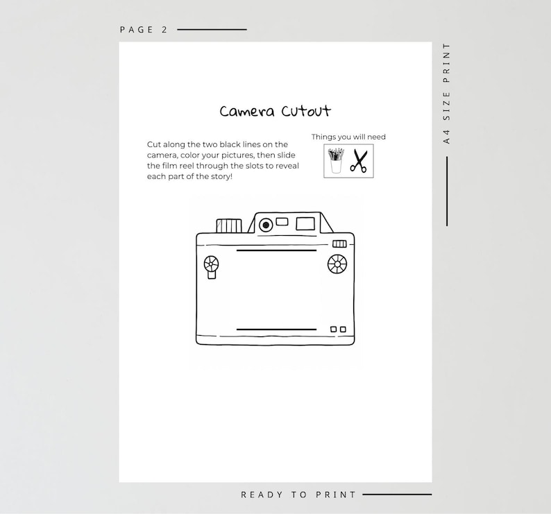 May include: A black and white line drawing of a camera cutout on a white page. The text "Camera Cutout" is above the camera illustration. Instructions are provided, along with icons of scissors and a small pot. The words "READY TO PRINT" are at the bottom.