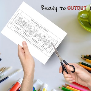 May include: A black and white illustrated activity sheet titled "Jesus and the Little Children" is being cut with scissors. The sheet includes text and illustrations depicting a Bible story. The words "Ready to CUTOUT" are written at the top.