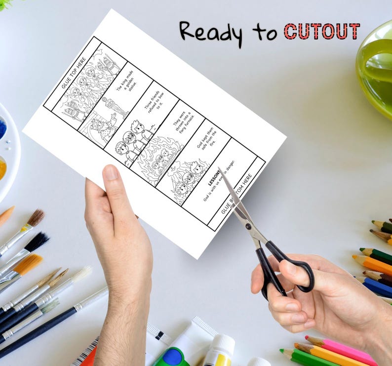 May include: A black and white illustrated comic strip with the text "Ready to CUTOUT". The comic strip depicts a story with text bubbles and the words "GLUE TOP HERE" and "GLUE BOTTOM HERE". Scissors are cutting the paper.