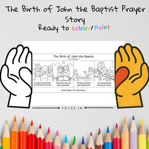 May include: A colouring page titled "The Birth of John the Baptist Prayer Story." The page features illustrations from Luke, Chapter 1, with text prompts. The words "Ready to colour/Paint" are written above the page. A row of coloured pencils is at the bottom.