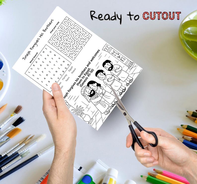 May include: A black and white activity sheet with the text "Joseph Forgives His Brothers" is being cut with scissors. The sheet includes a word search, a maze, and an illustration of a biblical scene. The words "Ready to CUTOUT" are written at the top.