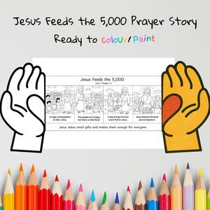 May include: A coloring page titled "Jesus Feeds the 5,000 Prayer Story." The black and white illustration depicts a biblical scene with text. The words "Ready to colour/Paint" are above the illustration. Colored pencils are at the bottom.