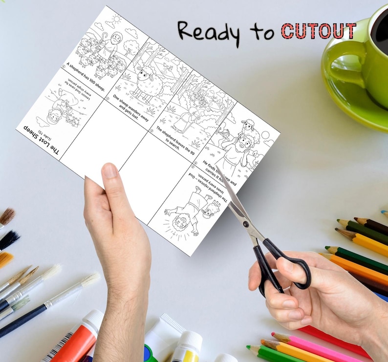 May include: A black and white illustrated cutout sheet with the text "Ready to CUTOUT". The sheet depicts a story about a shepherd and a lost sheep. Scissors are cutting the sheet. Colored pencils, paint tubes, and a green mug are in the background.
