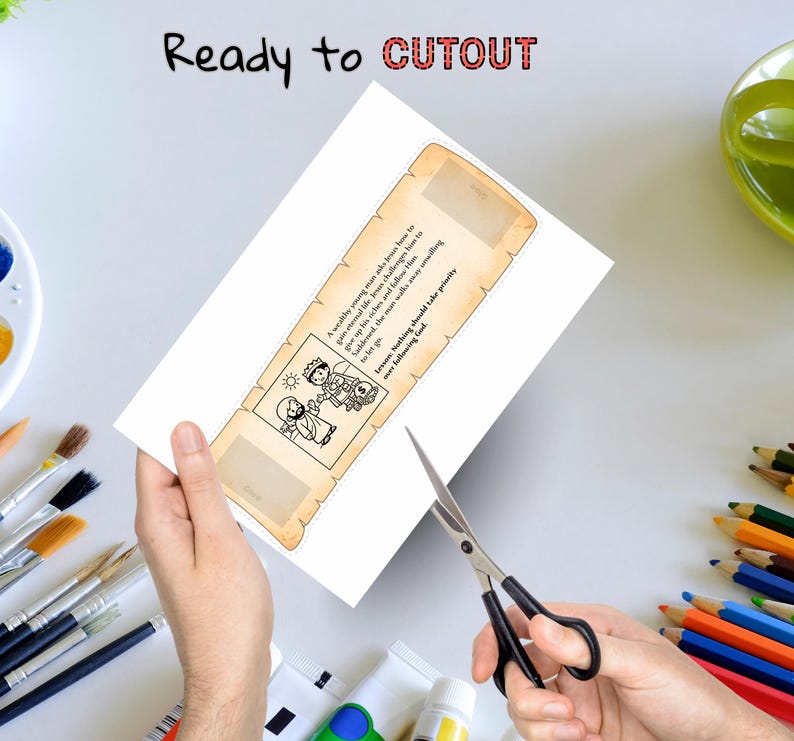May include: A white paper bookmark with a scroll design and text, being cut out with scissors. The bookmark features a black and white illustration and the words "Ready to CUTOUT". The text on the bookmark reads "A wealthy young man asks Jesus how to gain eternal life. Jesus challenges him to give up his riches and follow Him. Saddened, the man walks away unwilling to let go. Lesson: Nothing should take priority over following God."