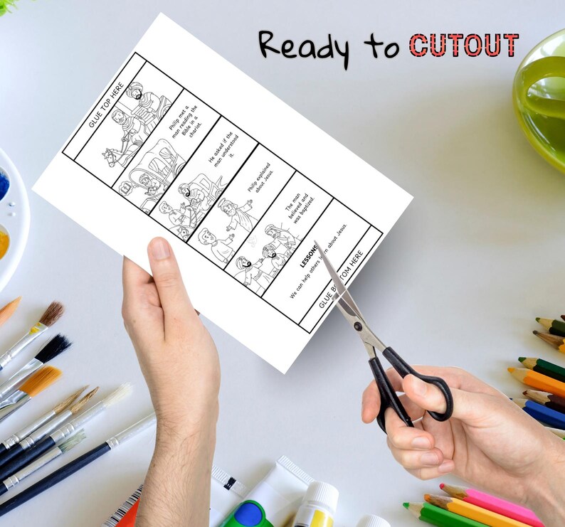 May include: A white paper with a black and white comic strip is being cut with scissors. The comic strip tells a story with text and illustrations. The words "Ready to CUTOUT" are written at the top.