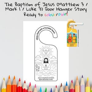 May include: A white door hanger with a black and white illustration depicting the baptism of Jesus. The text "The Baptism of Jesus" and "Ready to colour/paint" are at the top. The hanger includes the text "Obey God with a humble heart."