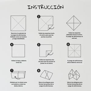 May include: A white instructional diagram with the word "INSTRUCCI&Oacute;N" at the top. The diagram shows a step-by-step guide on how to fold a paper fortune teller, with numbered steps and illustrations.