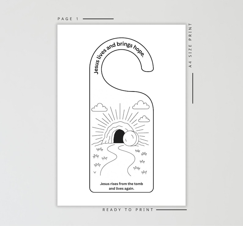 Pode incluir: Cabide de porta a preto e branco com tema religioso. O design apresenta uma ilustra&ccedil;&atilde;o de um t&uacute;mulo com um caminho que conduz a ele, raios de sol, nuvens e o texto "Jesus vive e traz esperan&ccedil;a" e "Jesus ressuscita do t&uacute;mulo e vive de novo."