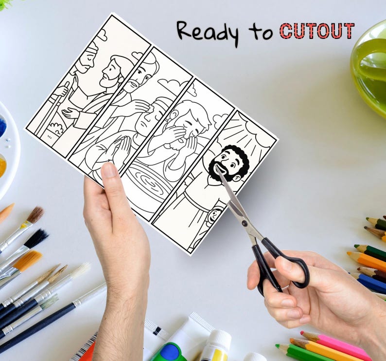 May include: A black and white illustrated print with four panels depicting religious figures. The text "Ready to CUTOUT" is written at the top. A pair of scissors is cutting the print. Paintbrushes, paint tubes, and colored pencils are in the background.