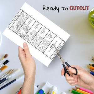 K&ouml;nnte beinhalten: Eine Person schneidet mit einer Schere ein wei&szlig;es Papier mit einem schwarz-wei&szlig;en Comic-Strip aus. Auf dem Papier steht der Text "Ready to CUTOUT" und "GLUE TOP HERE". Der Comic-Strip erz&auml;hlt eine Geschichte mit Textblasen.