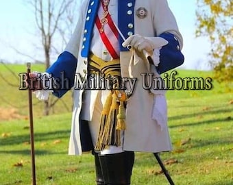 May include: A cream-colored military uniform with blue and white accents, gold trim, and a red and white sash. The uniform features a high collar and is worn with black boots. The text "British Military Uniforms" is displayed.