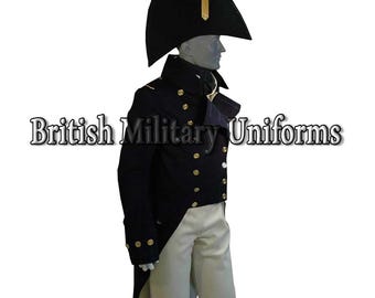 May include: A navy blue military uniform with gold buttons, a black hat, and white pants. The uniform is displayed on a mannequin. The text "British Military Uniforms" is displayed in the image.