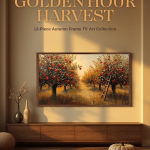 Op de afbeelding: Een 12-delige digitale kunstcollectie voor een frame-tv genaamd GOLDEN HOUR HARVEST. Het getoonde kunstwerk toont een appelboomgaard met rode vruchten, bomen en een houten ladder in warm licht. De tekst bevat de titel en de beschrijving.