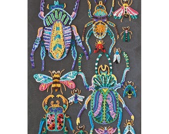 May include: A collection of beaded insect art pieces in various sizes and colors. The insects include beetles, butterflies, and other bugs, with intricate patterns and details. The artwork is displayed on a dark gray background.