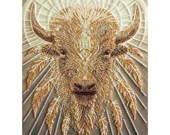 May include: Detailed beaded artwork of a bison head with horns, featuring intricate patterns and textures. The bison is rendered in shades of brown, gold, and cream, with feather accents. The background has a radial design.