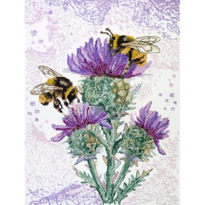 May include: Cross-stitch design featuring two bees hovering over a purple thistle flower. The bees have black and yellow stripes, and the flower has green and purple hues. The background is a light purple, patterned fabric.