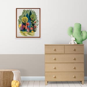 May include: A framed illustration of a colorful forest scene with a small red house in the distance. The trees are a mix of green, blue, yellow, and red.
