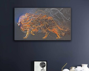May include: A framed artwork depicting a lion in profile, rendered with intricate lines and dots in shades of orange, gold, and white against a dark gray background. The lion's mane flows dynamically, suggesting movement. The artwork is displayed on a dark blue wall.