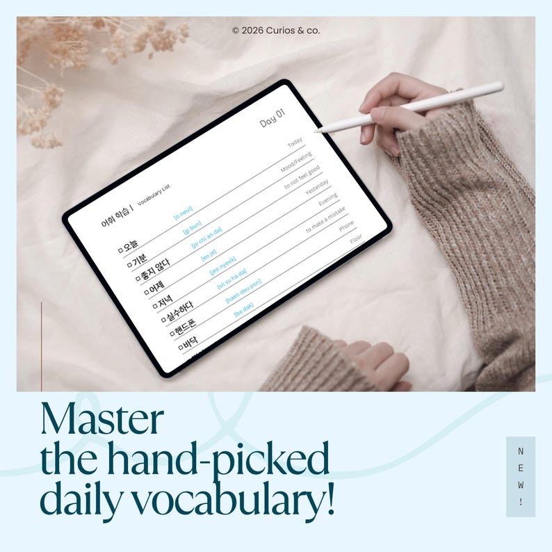 May include: A digital tablet displaying a vocabulary list with Korean words and English translations. The screen shows "Day 01" and phrases like "Today" and "Mood/Feeling." A stylus hovers over the screen. The text "Master the hand-picked daily vocabulary!" is at the bottom.