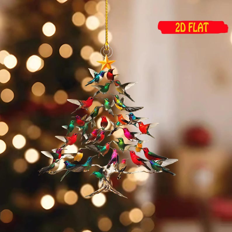 May include: A 2D flat Christmas tree ornament shaped like a tree, adorned with colorful birds. The birds are in various colors, including red, green, blue, and yellow. A gold star hangs at the top, and the text "2D FLAT" is in a red banner.