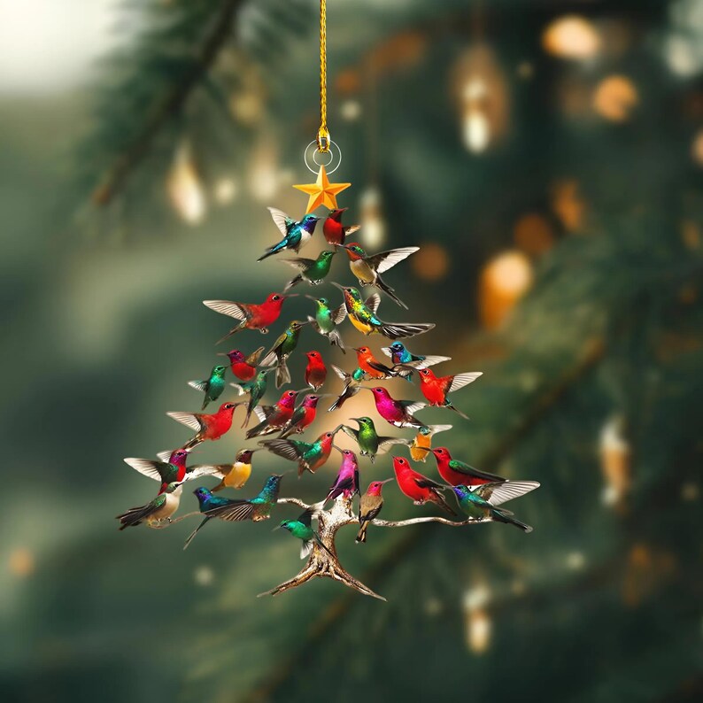 May include: A Christmas tree ornament shaped like a tree, composed of colorful birds. The birds are in various colors, including red, green, blue, and yellow. A gold star tops the tree, suspended by a gold string.