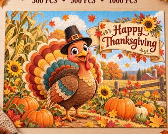 May include: A rectangular jigsaw puzzle featuring a cartoon turkey wearing a black pilgrim hat, standing in a field with pumpkins, corn stalks, and a banner that reads Happy Thanksgiving. The puzzle options are 300 PCS, 500 PCS, and 1000 PCS.
