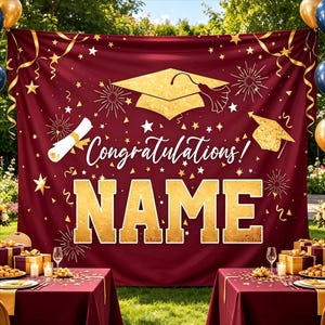 May include: Burgundy graduation banner with gold accents. Features a mortarboard, scroll, and the words "Congratulations!" and "NAME" in gold. Includes gold stars, fireworks, and ribbons. Perfect for a graduation party.