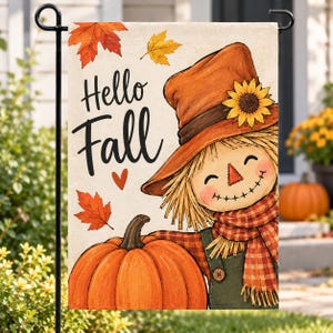 May include: A rectangular garden flag featuring the text Hello Fall in black script. The design includes a smiling scarecrow wearing an orange hat with a sunflower, a red plaid scarf, and green overalls, positioned next to a large orange pumpkin.