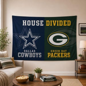 May include: A rectangular wall tapestry featuring a House Divided design. The left side is navy blue with a white Dallas Cowboys star and text. The right side is dark green with a yellow and white Green Bay Packers G logo and text.