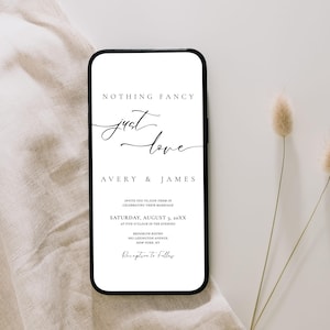 May include: A smartphone displays a wedding invitation with the words "Nothing Fancy, Just Love" in elegant script. The invitation includes the names Avery & James, event details, and venue information. The phone rests on a neutral-toned fabric.