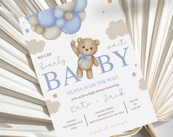 May include: Baby shower invitation with a teddy bear holding blue and beige balloons. The invitation reads "We can bearly wait BABY" and includes event details. The design incorporates stars and cloud illustrations.