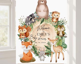May include: A baby shower welcome sign featuring watercolor illustrations of woodland animals, including a bear, raccoon, squirrel, fox, owl, deer, and rabbit. The sign has the text "Welcome to EMILY'S Baby shower" and the date.