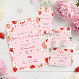 May include: A baby shower invitation suite with a pink gingham pattern and strawberry illustrations. The invitation reads "Someone berry sweet is on the way!" and includes details for the event. A thank you tag and other cards are also included.