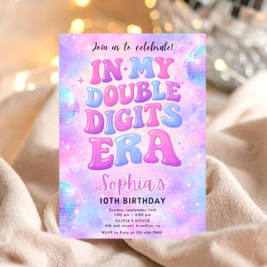 May include: A birthday party invitation with a colorful design. The text reads "Join us to celebrate! IN MY DOUBLE DIGITS ERA Sophia's 10TH BIRTHDAY." The invitation features disco balls and a pastel color scheme.
