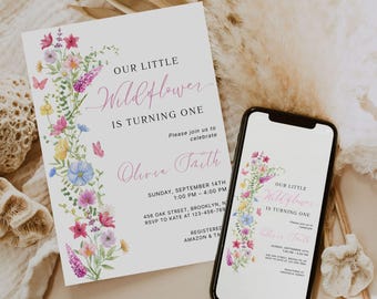 May include: A white invitation card and a smartphone screen display the text "OUR LITTLE Wildflower IS TURNING ONE" with floral accents. The invitation includes event details and the name "Olivia Taith".