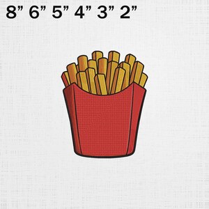 May include: A white ceramic mug with a black handle and the text "But First, Coffee" in a bold, black font. The mug is set against a blurred background, suggesting a cozy setting.