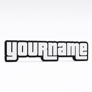 May include: A three-dimensional sign featuring the word YOURNAME in a bold, white, sans-serif font with a thick black outline. The letters are connected in a single block, creating a solid, raised display piece with a clean, modern appearance.