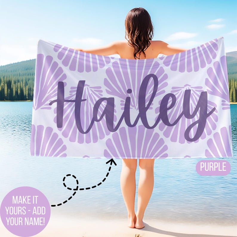 May include: A personalized beach towel with the name "Hailey" in purple script. The towel features a seashell pattern in light purple on a white background. The word "PURPLE" is in a purple box. The text "MAKE IT YOURS - ADD YOUR NAME!" is in a pink circle.