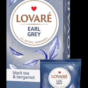 May include: A box and a packet of LOVARÉ Earl Grey tea. The packaging is blue with white leaf illustrations. Text on the packaging reads "Earl Grey, black tea & bergamot, all natural ingredients." The brand name is in a circular design.