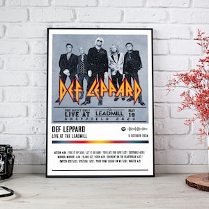May include: A black and white poster with a band's name, "Def Leppard", in large, bold letters. The poster advertises a concert at The Leadmill in Sheffield, England on May 19, 2023. The poster also includes a Spotify icon and the text "Def Leppard Live at The Leadmill" with a date of October 11, 2024. The poster features a black and white photo of the band members.