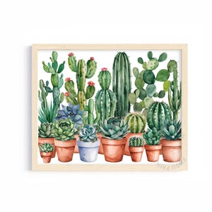 May include: Watercolor painting of a collection of potted cacti and succulents in various shades of green. The cacti are in terracotta pots, and the succulents are in terracotta and blue pots. The painting is framed in a light wood frame.