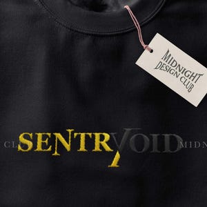 May include: Black crew neck sweatshirt with the word "SENTRVOID" in yellow embroidered lettering. The sweatshirt has a tag that says "MIDNIGHT DESIGN CLUB". The background is black and yellow.