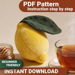 May include: A plush lemon-shaped object with a dark green leaf, positioned between a small glass jar of honey with a wooden dipper and a glass cup of steaming tea. The image includes text reading PDF Pattern, Instruction step by step, and INSTANT DOWNLOAD.